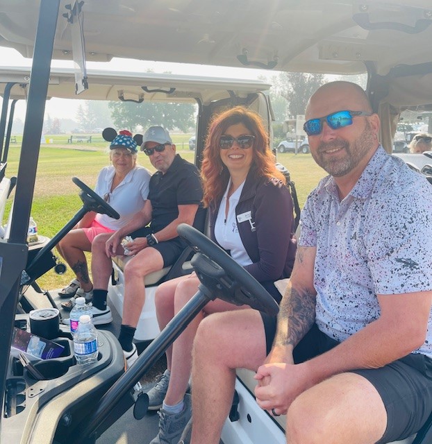 Golfers in their carts at the Charity Golf Tournament.