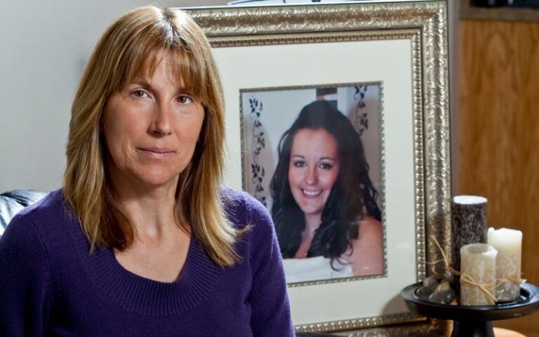 Lynne Rosychuk beside a framed photograph of her daughter Jessica.