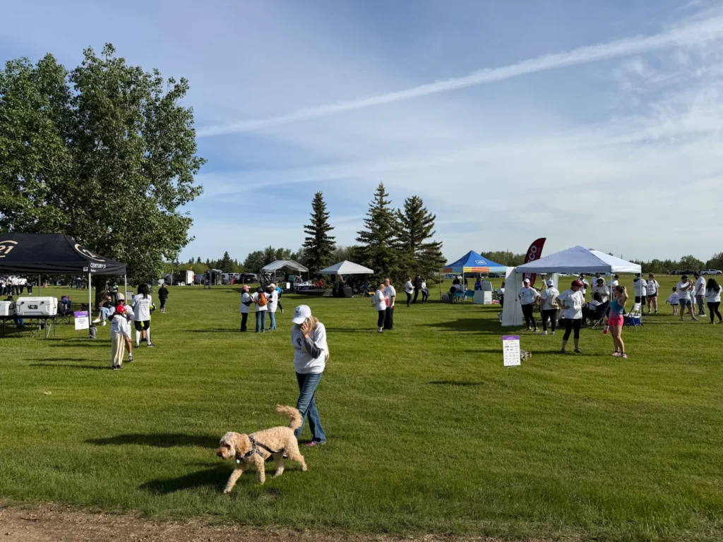 People walking through the event village at the Break Free Run