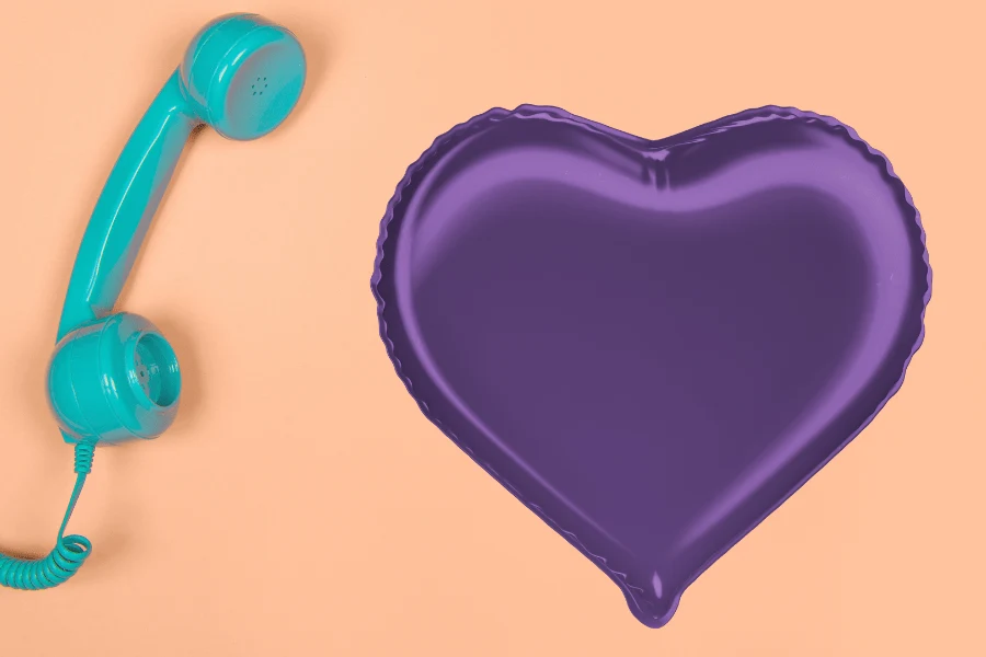 A telephone handset beside a purple heart.